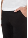 Men's black trousers are monochrome