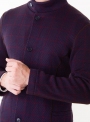 The jacket is man's knitted brown in a burgundy cage